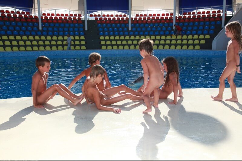 Swimming dolphins photo gallery - Nudism is often equated with naturism