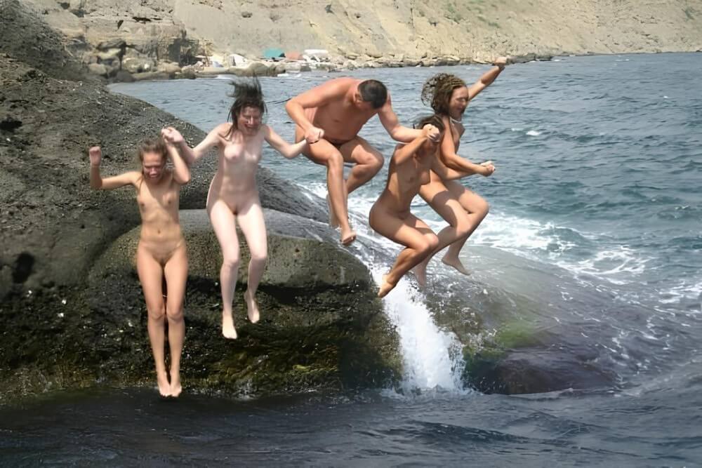 Mens and girls nudists on a beach - Naturism and respect for nature