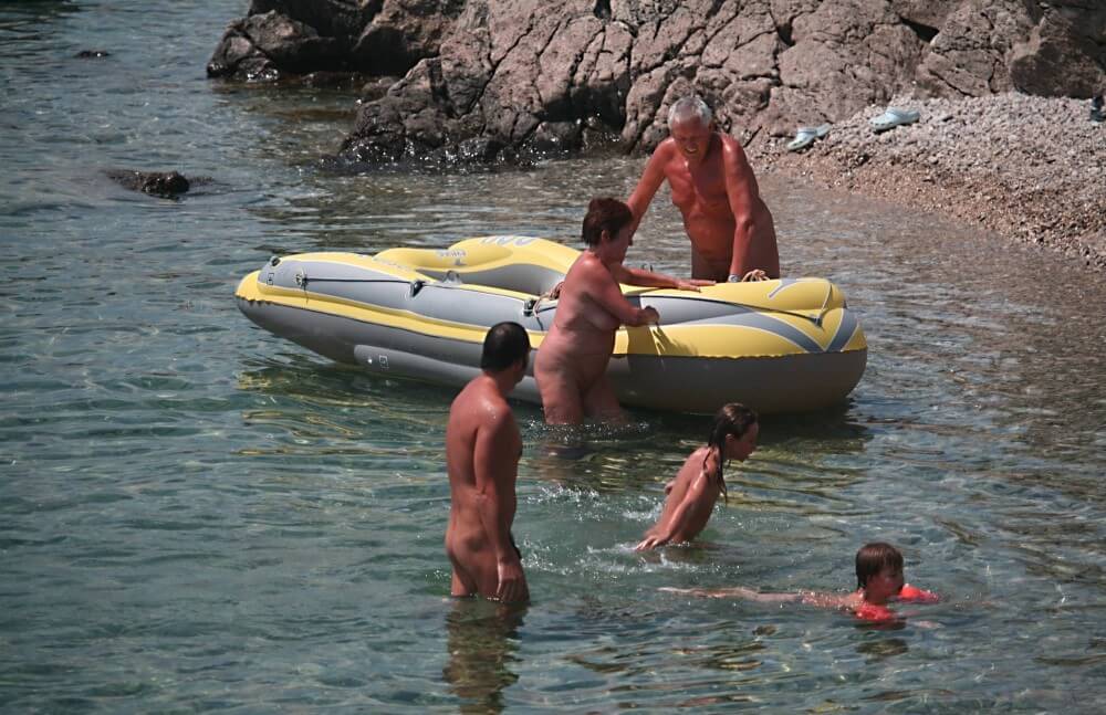 Lone Nudist in Yellow Boat photos - Nudism and naturism are based on naturalness and acceptance of ones body